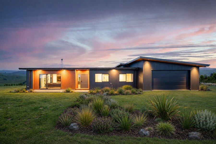 Aluminium weatherboard-clad home exterior at dusk