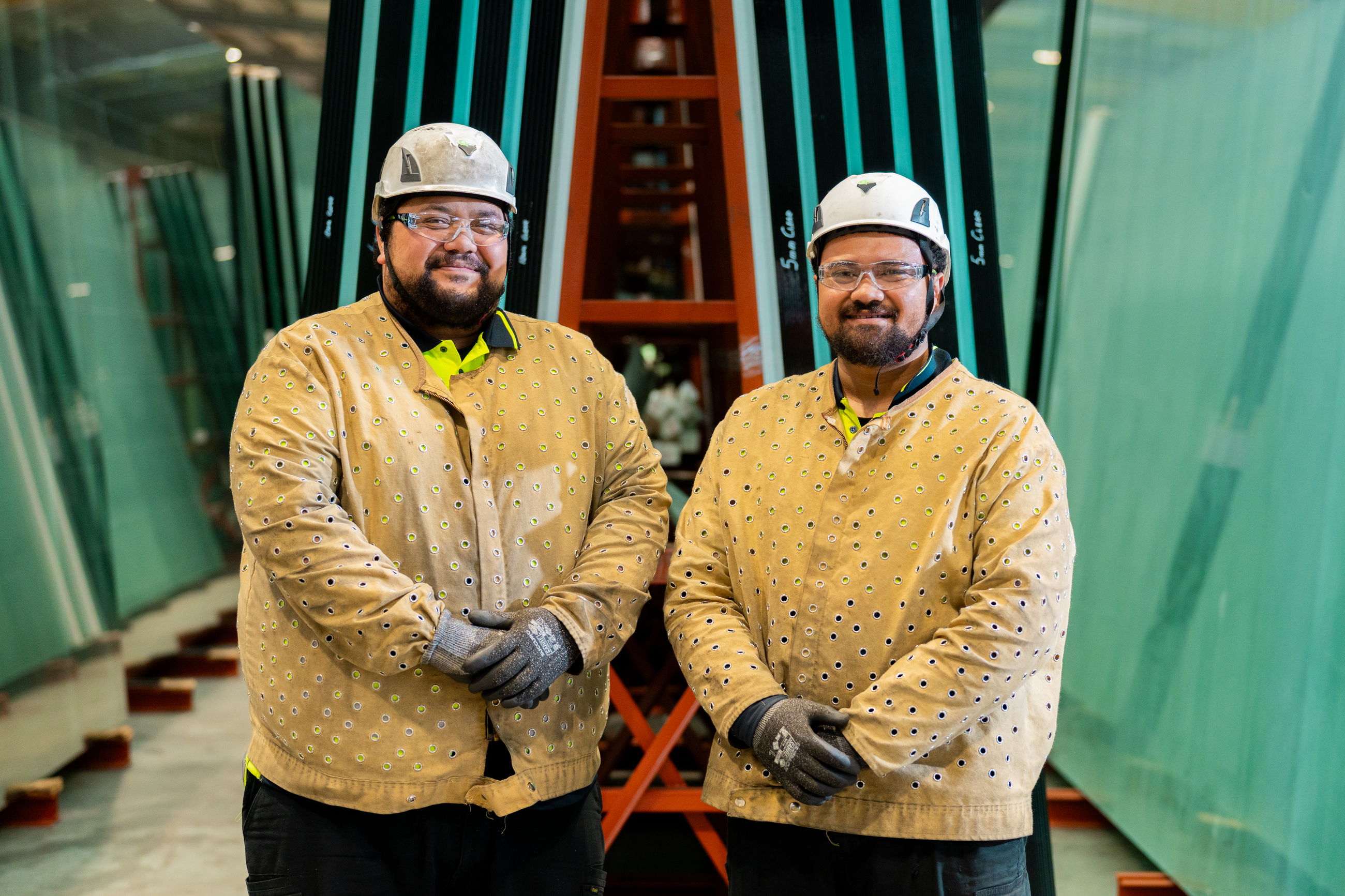 Two FMI Building Innovation employees in an Auckland high performance glass factory