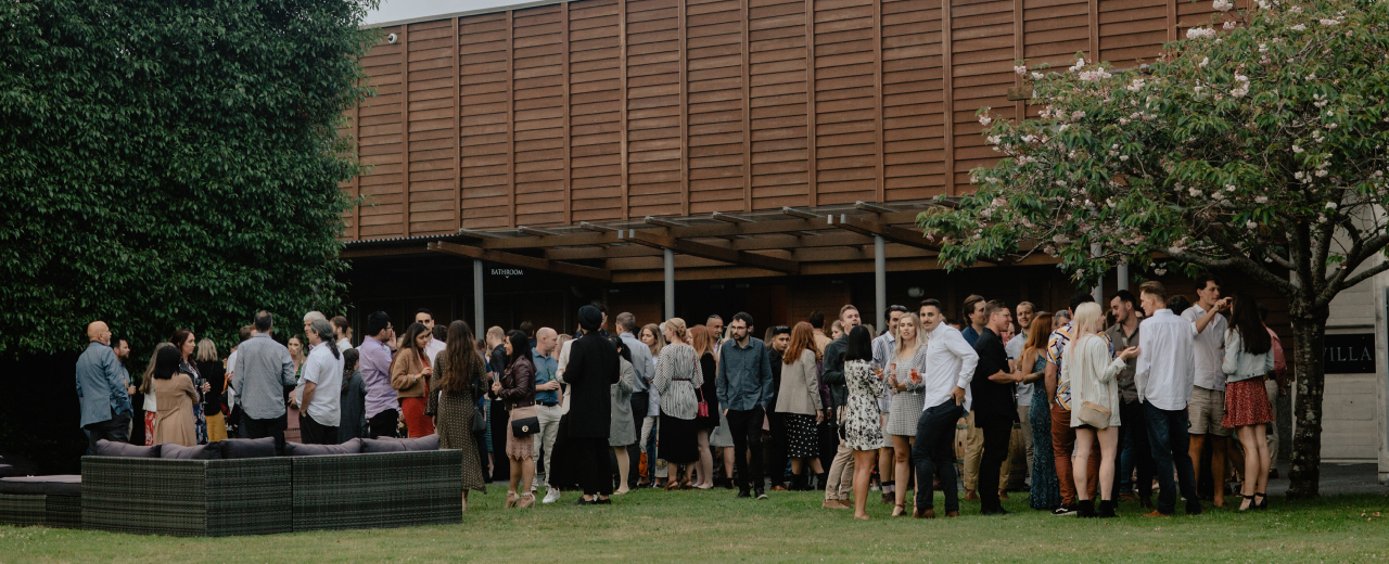 Image of the Woods staff outside in front of the Woods office