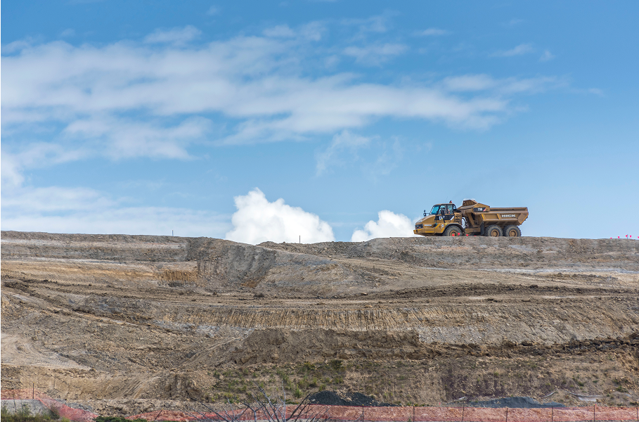 Image of land development with a earth moving machine