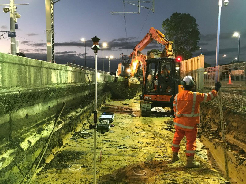 Image of survey equipment on street at night
